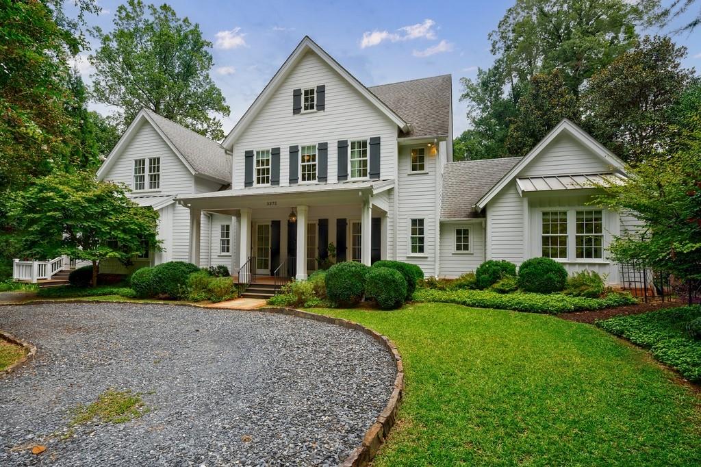 3375 Ridgewood Road Northwest Atlanta, GA 30327 - Photo 1 of 1 a front view of a house with a yard