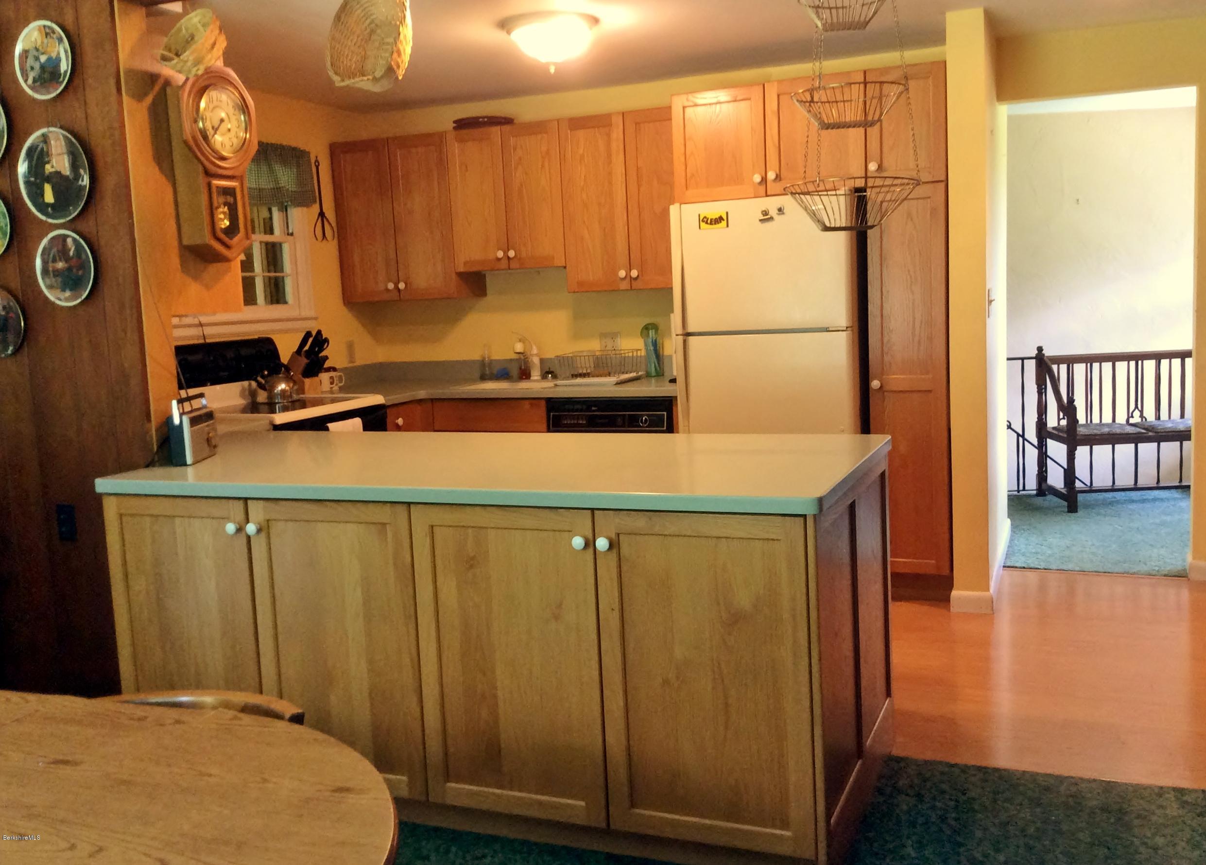 101 Patton Road Richmond, MA 01254 - Photo 14 of 23 a kitchen with a refrigerator and a sink