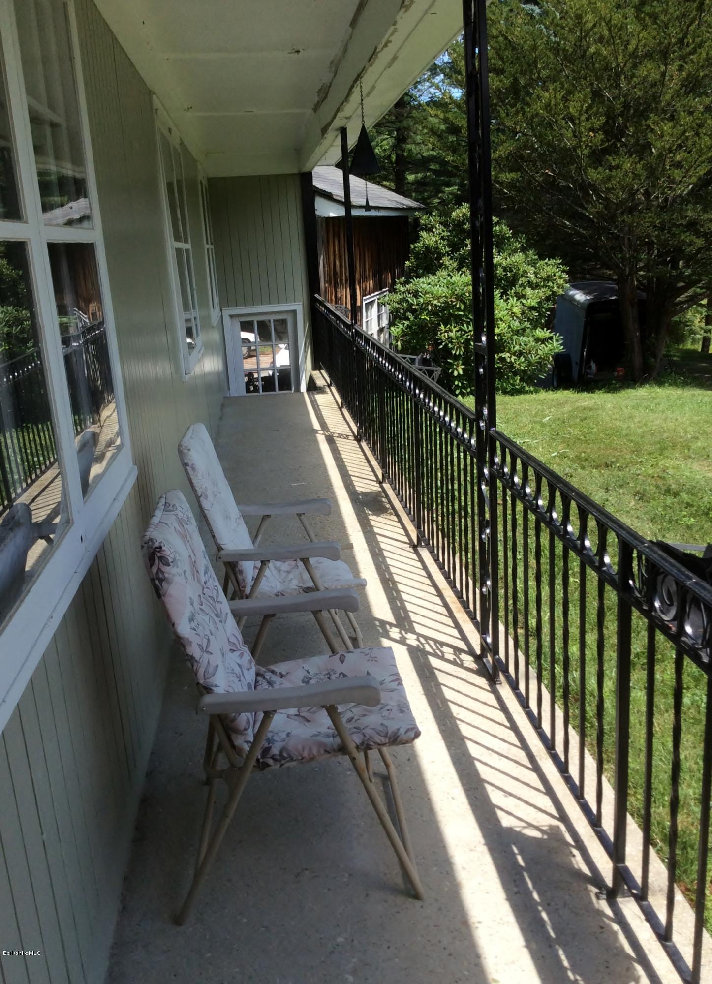 101 Patton Road Richmond, MA 01254 - Photo 7 of 23 a view of balcony with wooden floor and outdoor seating