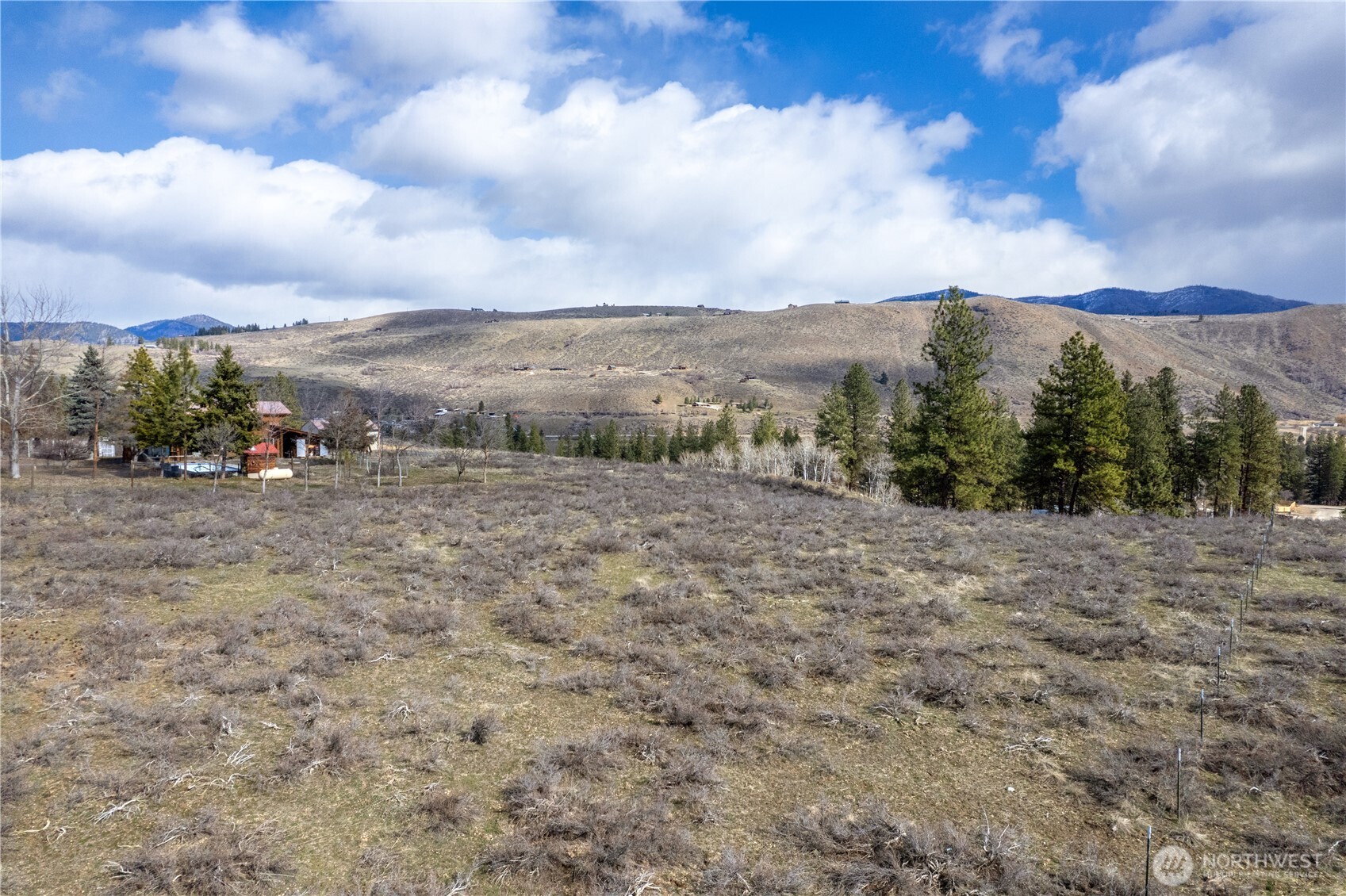 40-tbd Rabbit House Road Winthrop, WA 98862 - Photo 3 of 40 a view of a dry yard with mountains in the background