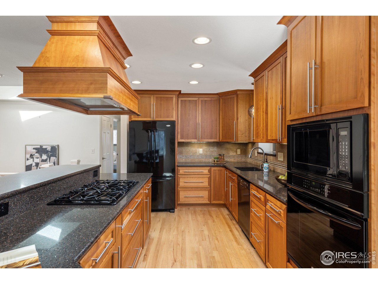 1120 Green Circle Boulder, CO 80305 - Photo 12 of 40 a kitchen with stainless steel appliances kitchen island granite countertop a stove and cabinets