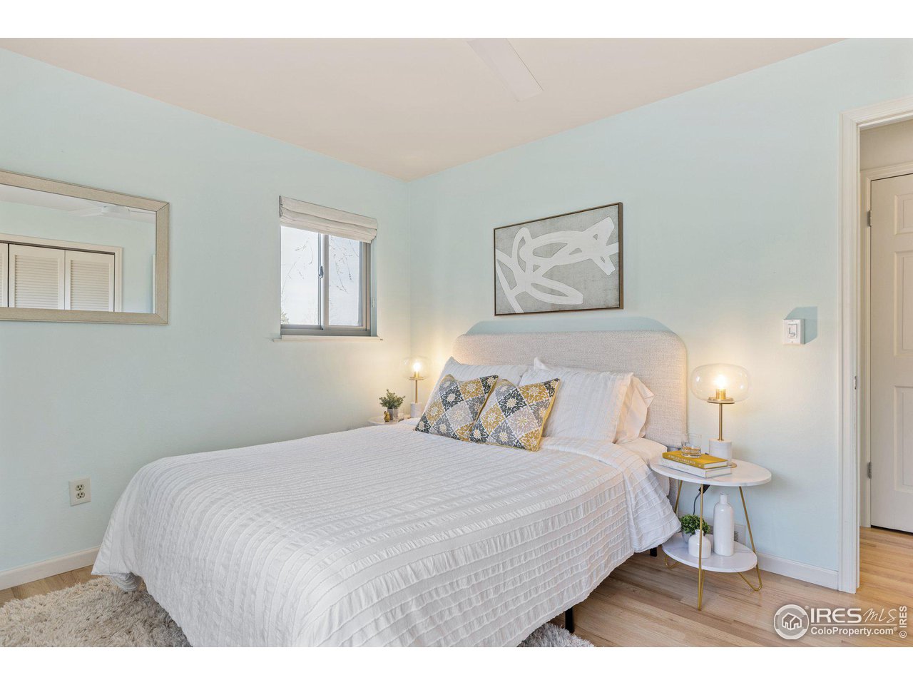 1120 Green Circle Boulder, CO 80305 - Photo 16 of 40 a bedroom with a bed and a lamp