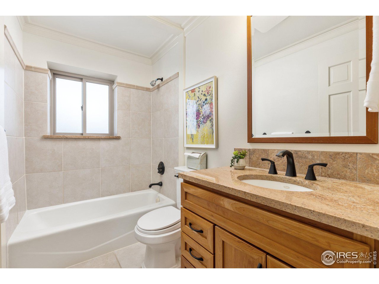 1120 Green Circle Boulder, CO 80305 - Photo 18 of 40 a bathroom with a granite countertop toilet sink and a bathtub