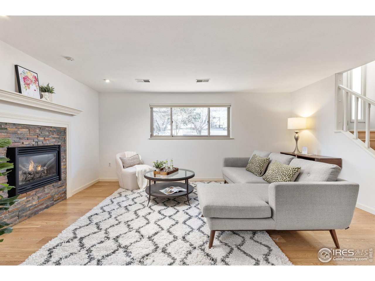 1120 Green Circle Boulder, CO 80305 - Photo 19 of 40 a living room with furniture a fireplace and a table