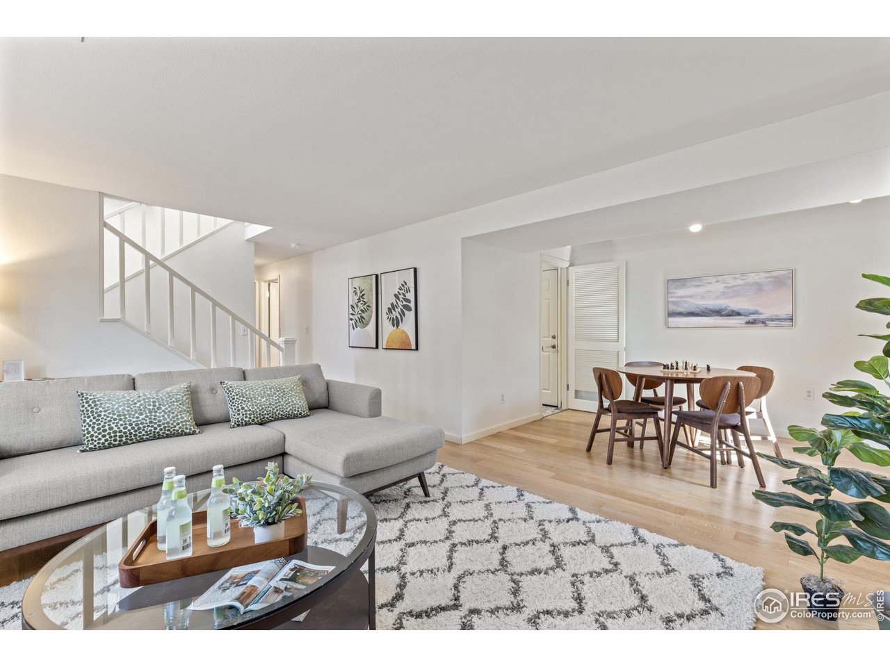 1120 Green Circle Boulder, CO 80305 - Photo 20 of 40 a living room with furniture and a dining table with wooden floor