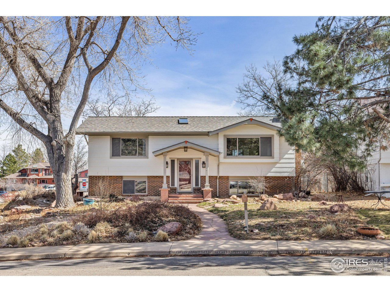 1120 Green Circle Boulder, CO 80305 - Photo 2 of 40 a front view of a house with a yard