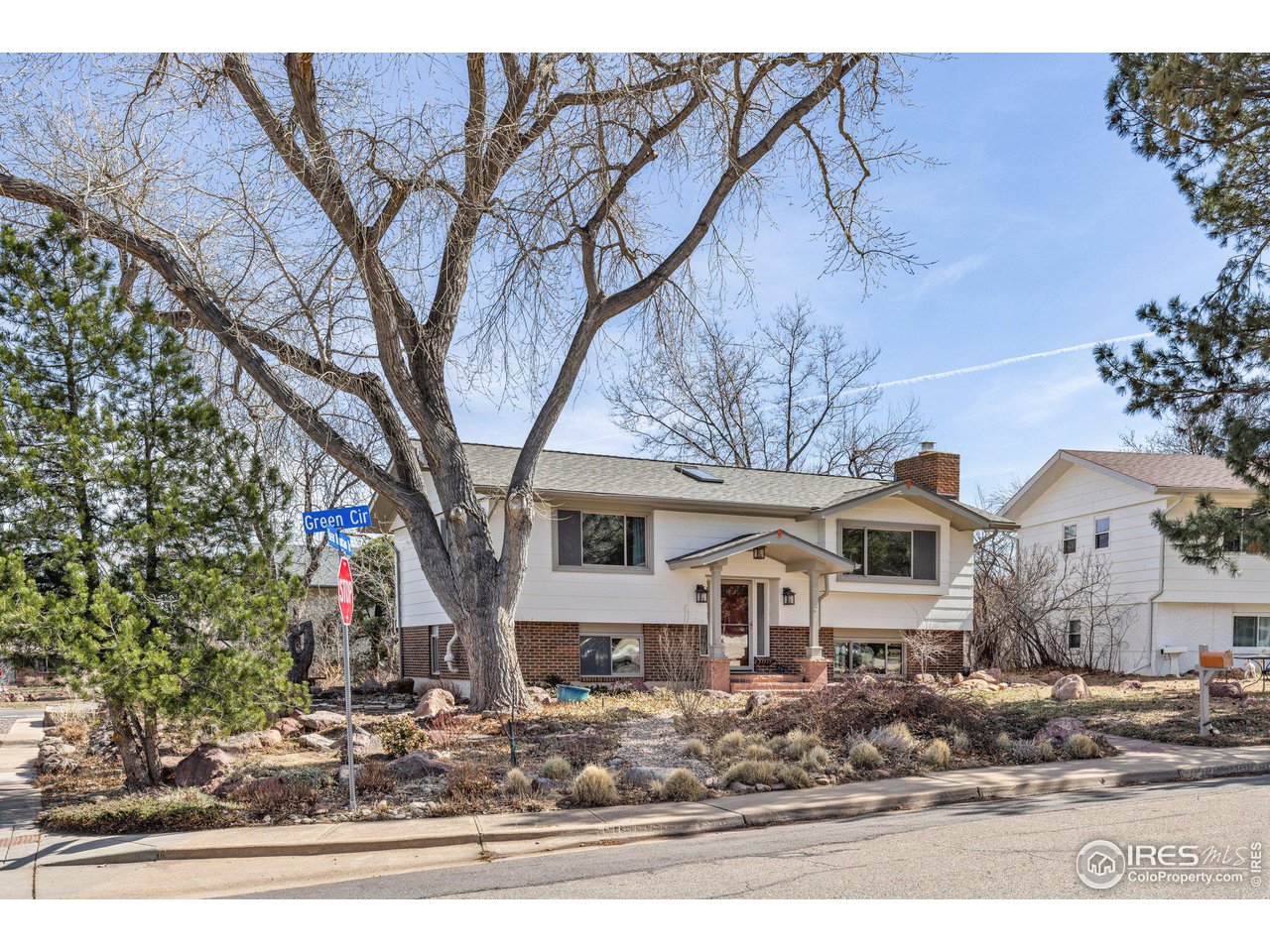 1120 Green Circle Boulder, CO 80305 - Photo 3 of 40 a front view of a house with garden