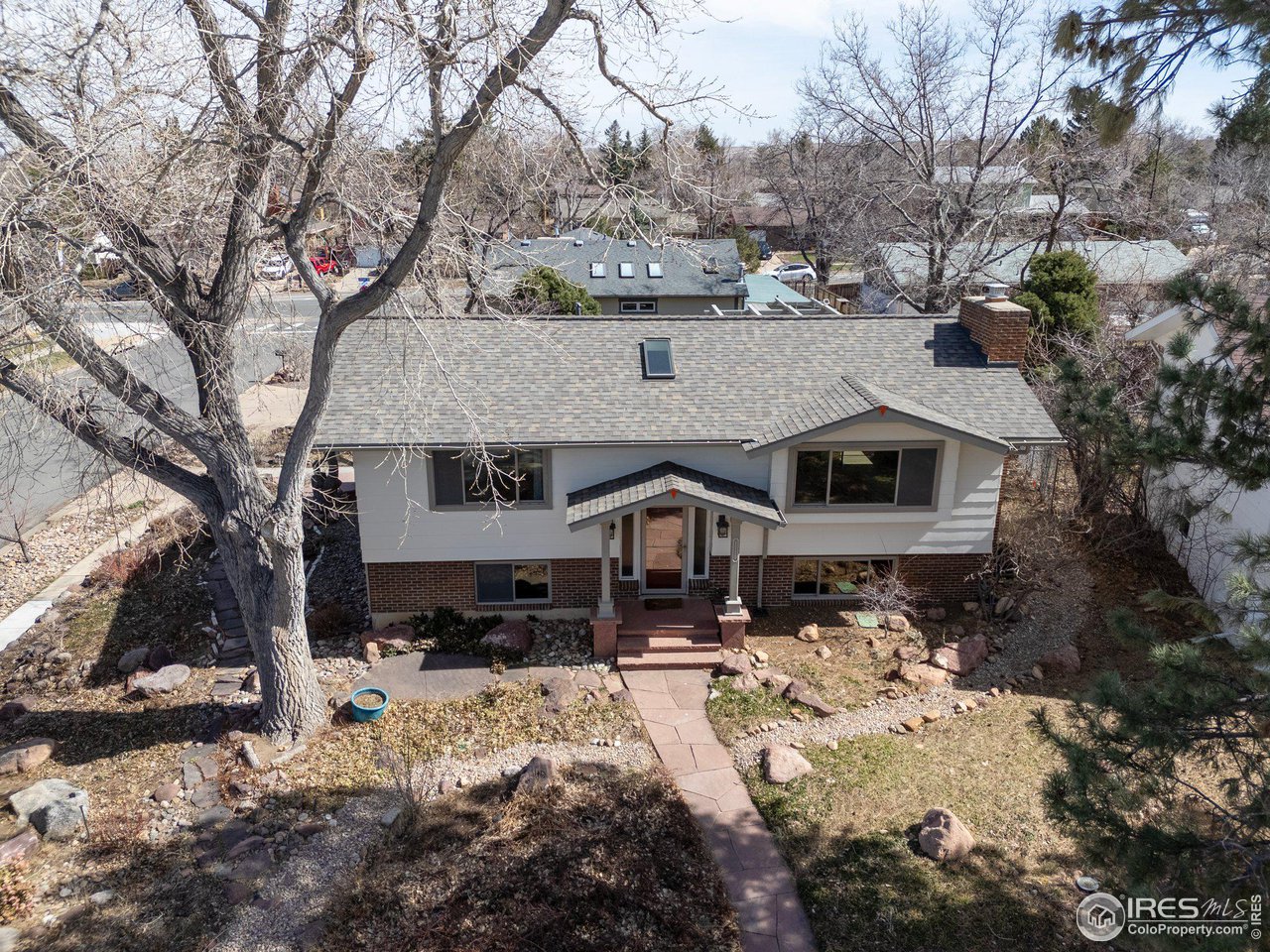 1120 Green Circle Boulder, CO 80305 - Photo 36 of 40 a front view of a house with a yard covered in snow