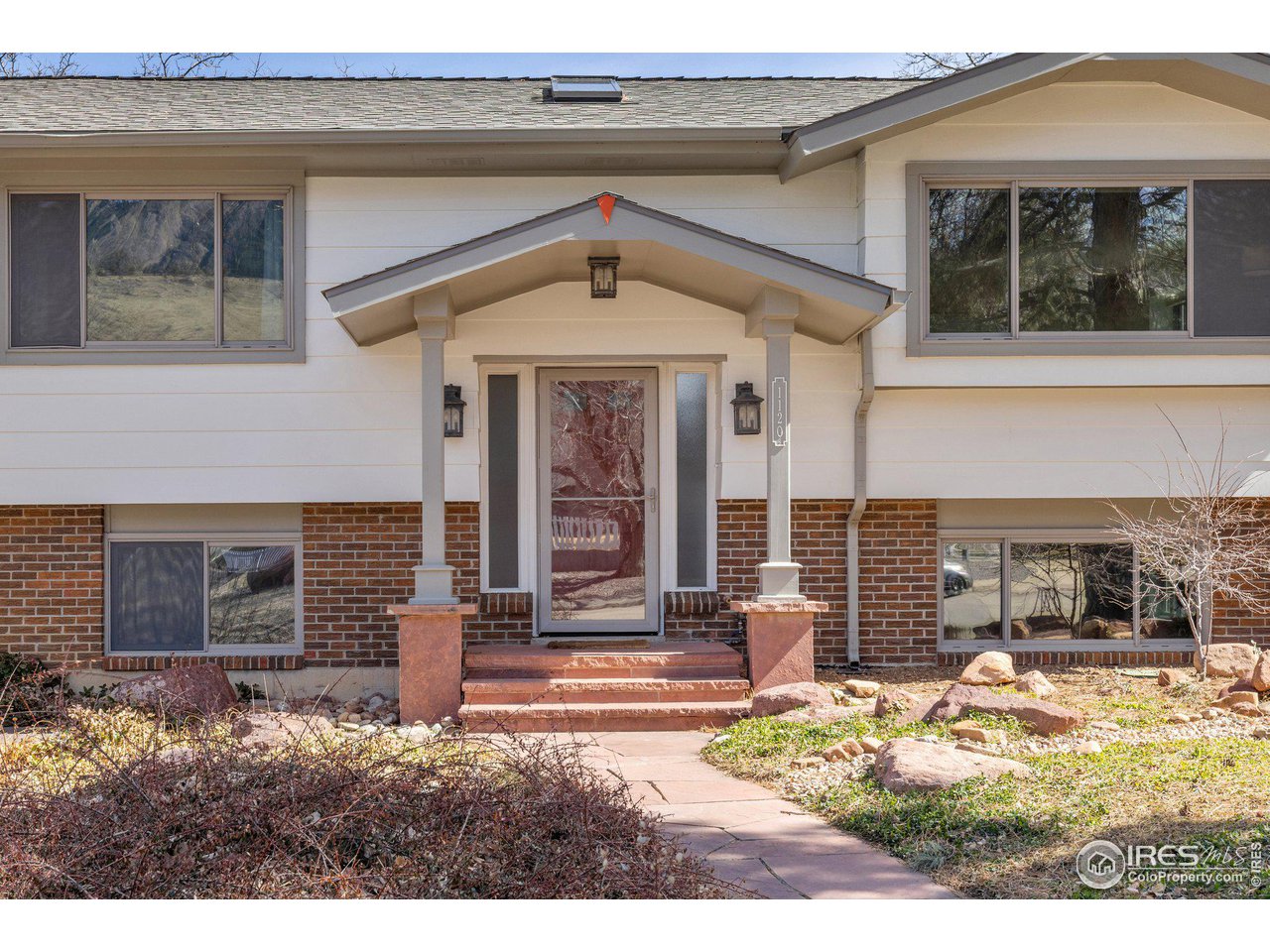 1120 Green Circle Boulder, CO 80305 - Photo 4 of 40 a front view of a house with garden