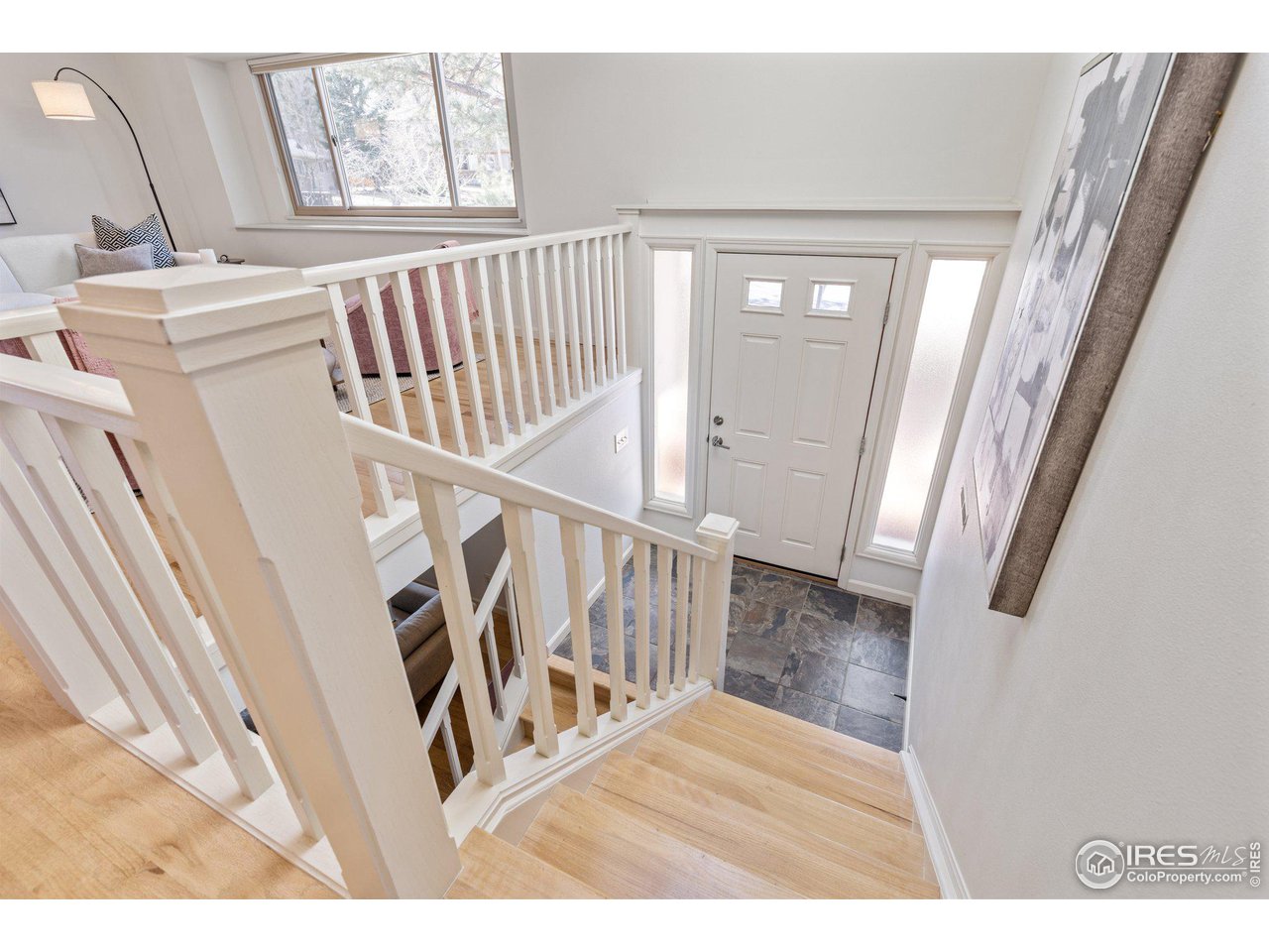 1120 Green Circle Boulder, CO 80305 - Photo 5 of 40 a view of a livingroom with wooden floor and stairs