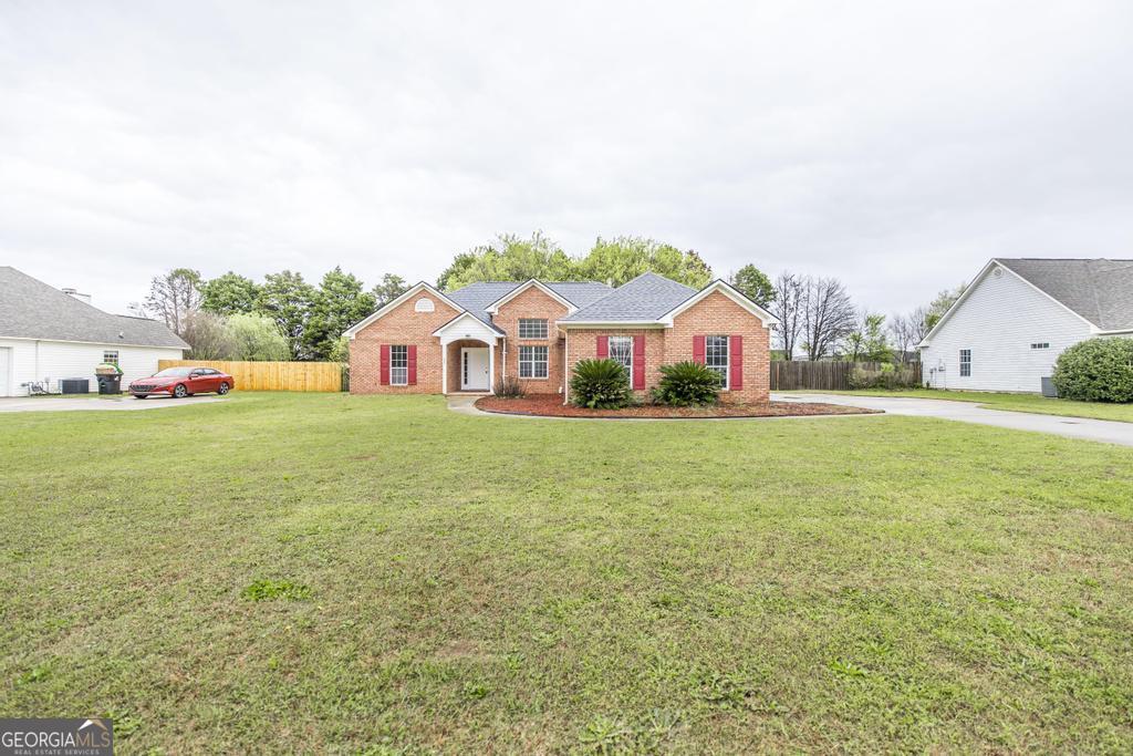 319 Smithville Church Road Warner Robins, GA 31088 - Photo 2 of 34 a view of house with garden and deck