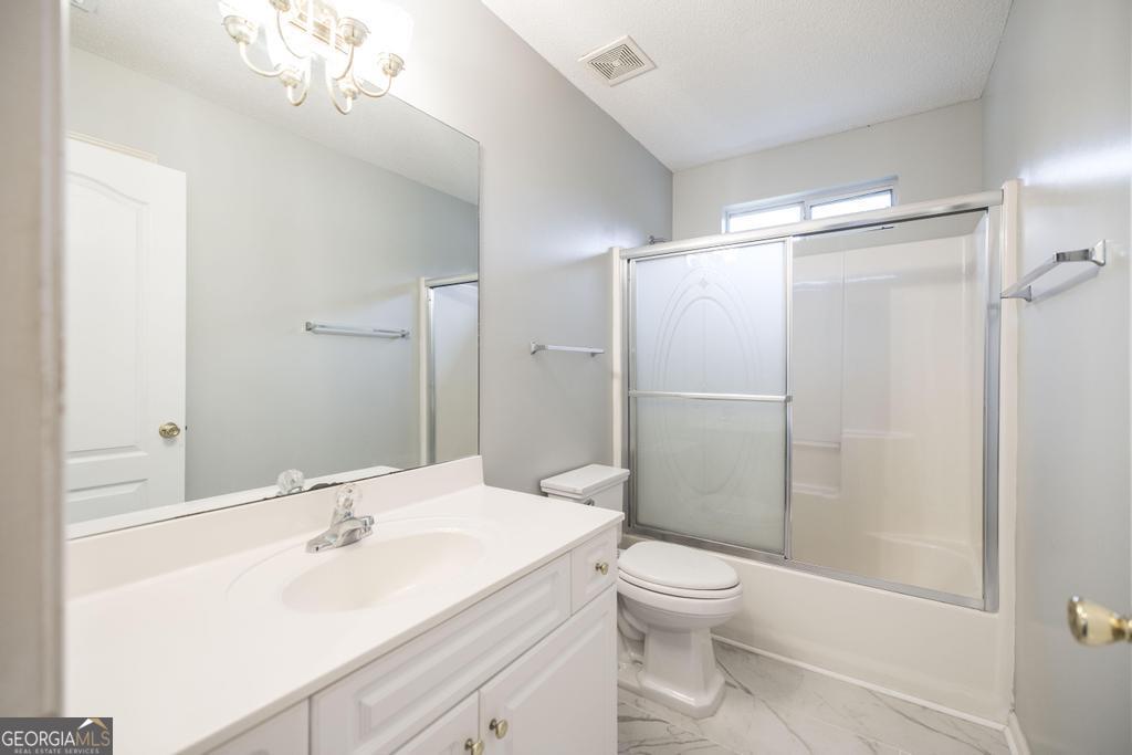319 Smithville Church Road Warner Robins, GA 31088 - Photo 25 of 34 a bathroom with a sink a toilet and shower