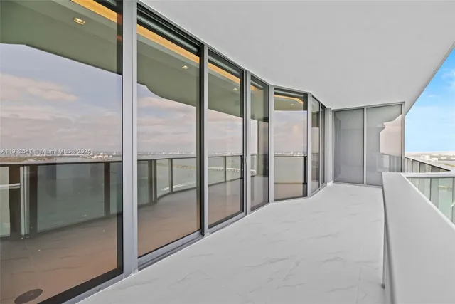 a bathroom with a shower and a glass door