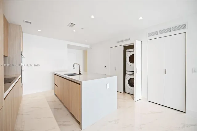 a front view of a house with plants