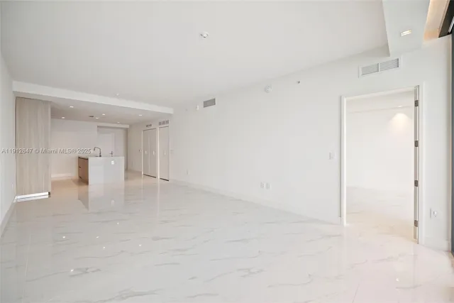a view of a swimming pool with outdoor seating