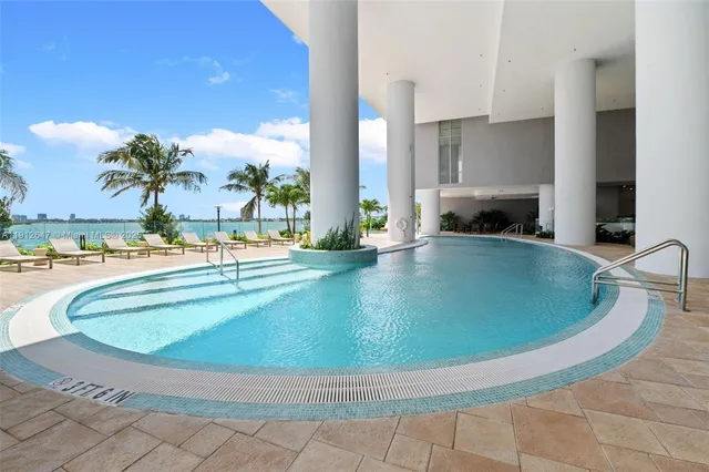 a view of a room with furniture and a porch
