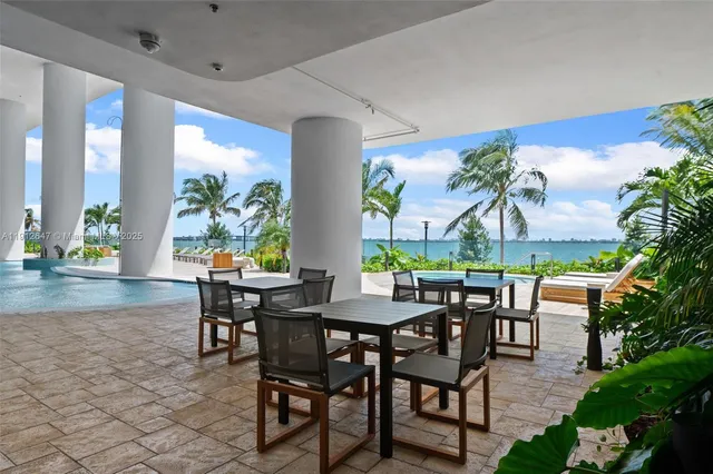 a view of a lounge chair in the backyard of a house