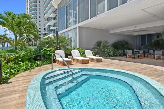 a view of a swimming pool with a patio