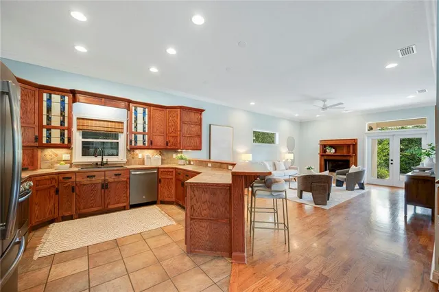 a kitchen with a sink stove and refrigerator