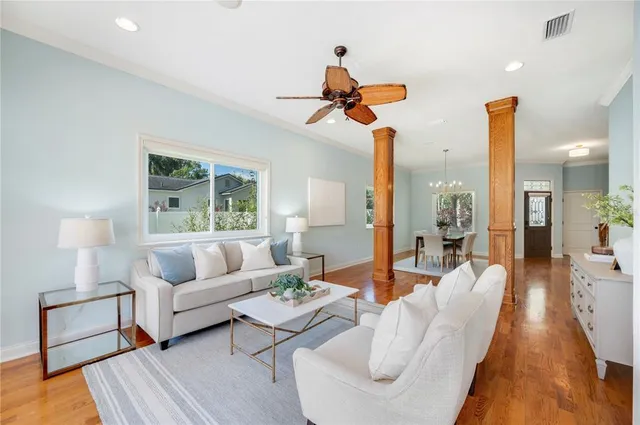 a view of a dining room with furniture window and wooden floor