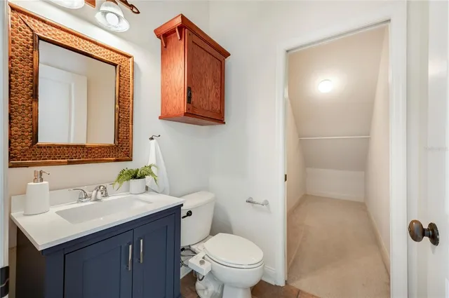 a view of a dining room with furniture a chandelier and wooden floor