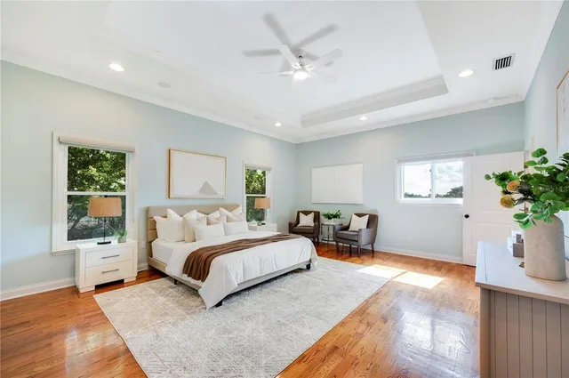 a spacious bathroom with a granite countertop sink mirror and vanity