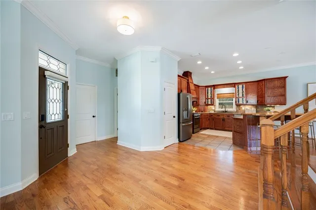 a view of a living room kitchen and a sink