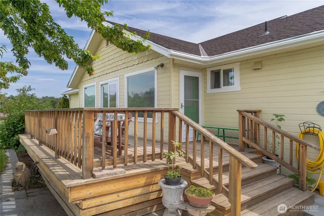 a view of balcony with wooden floor and fence