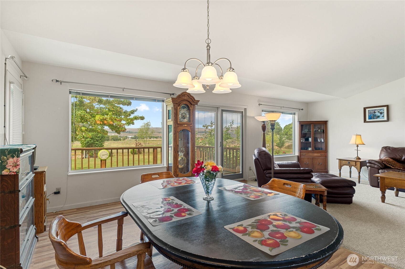19627 Rd A Northeast Soap Lake, WA 98851 - Photo 17 of 38 a dining room with furniture a chandelier and wooden floor