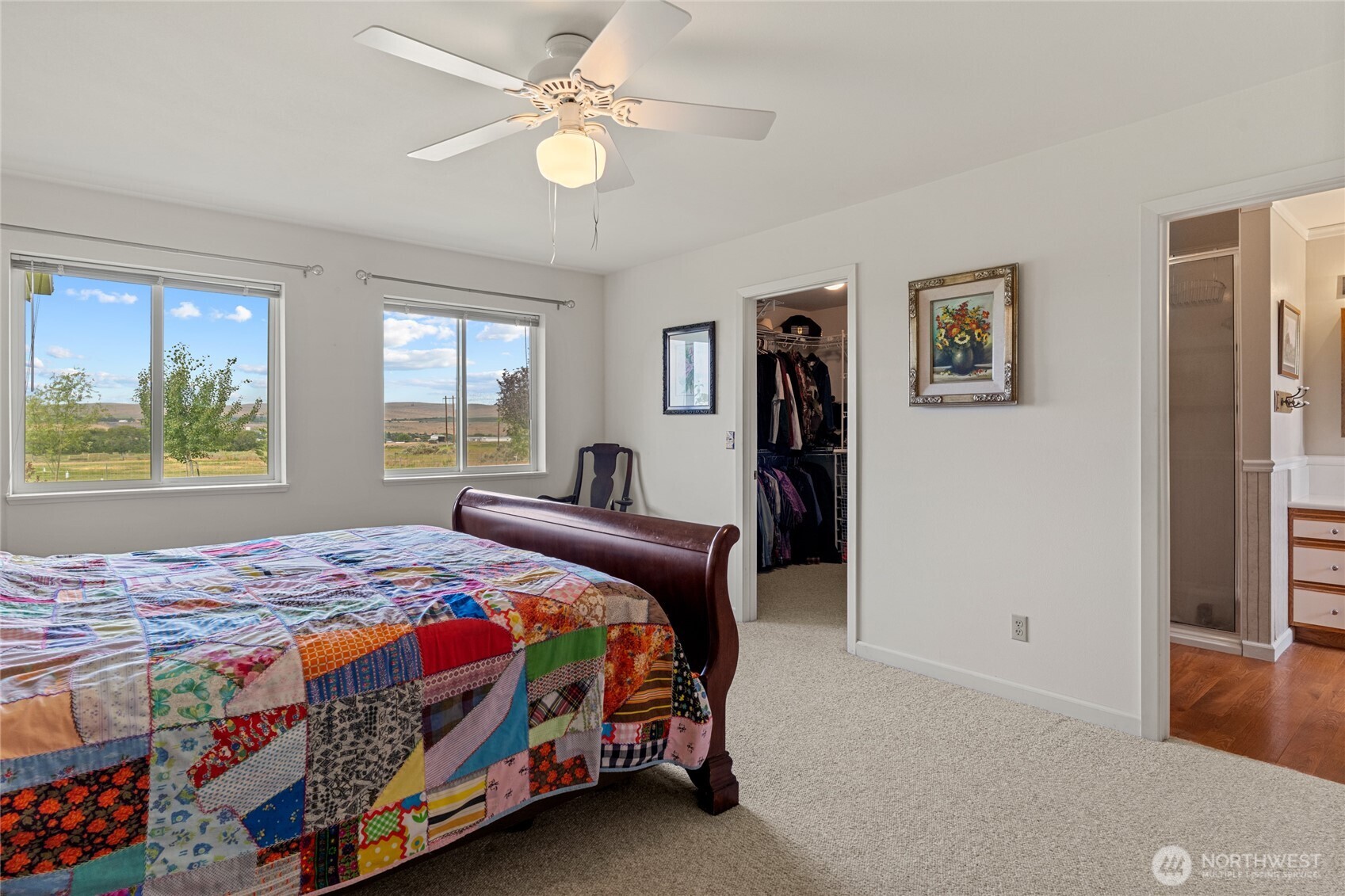 19627 Rd A Northeast Soap Lake, WA 98851 - Photo 33 of 38 a bedroom with a bed and a chandelier