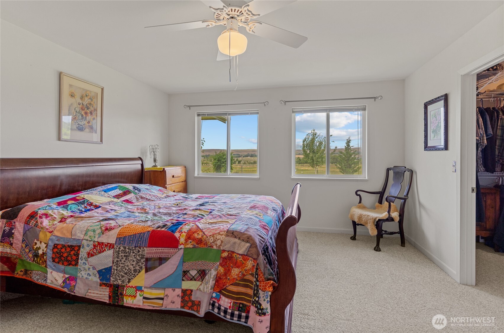 19627 Rd A Northeast Soap Lake, WA 98851 - Photo 34 of 38 a bedroom with a bed and a chandelier