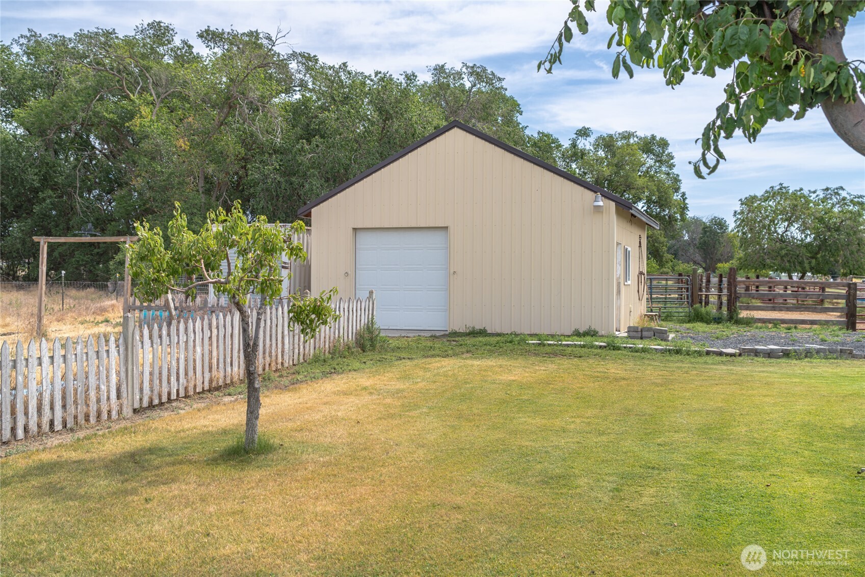 19627 Rd A Northeast Soap Lake, WA 98851 - Photo 9 of 38 a view of a house with backyard and tree