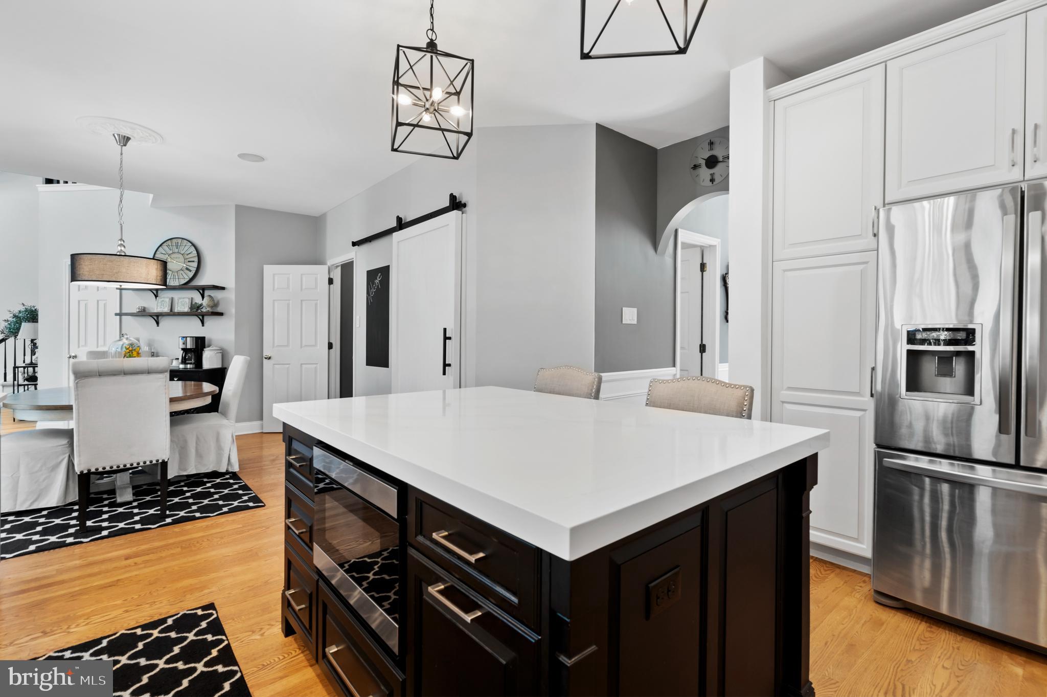 75 Bittersweet Drive Doylestown, PA 18901 - Photo 14 of 65 a kitchen that has a kitchen island wooden cabinets and stainless steel appliances