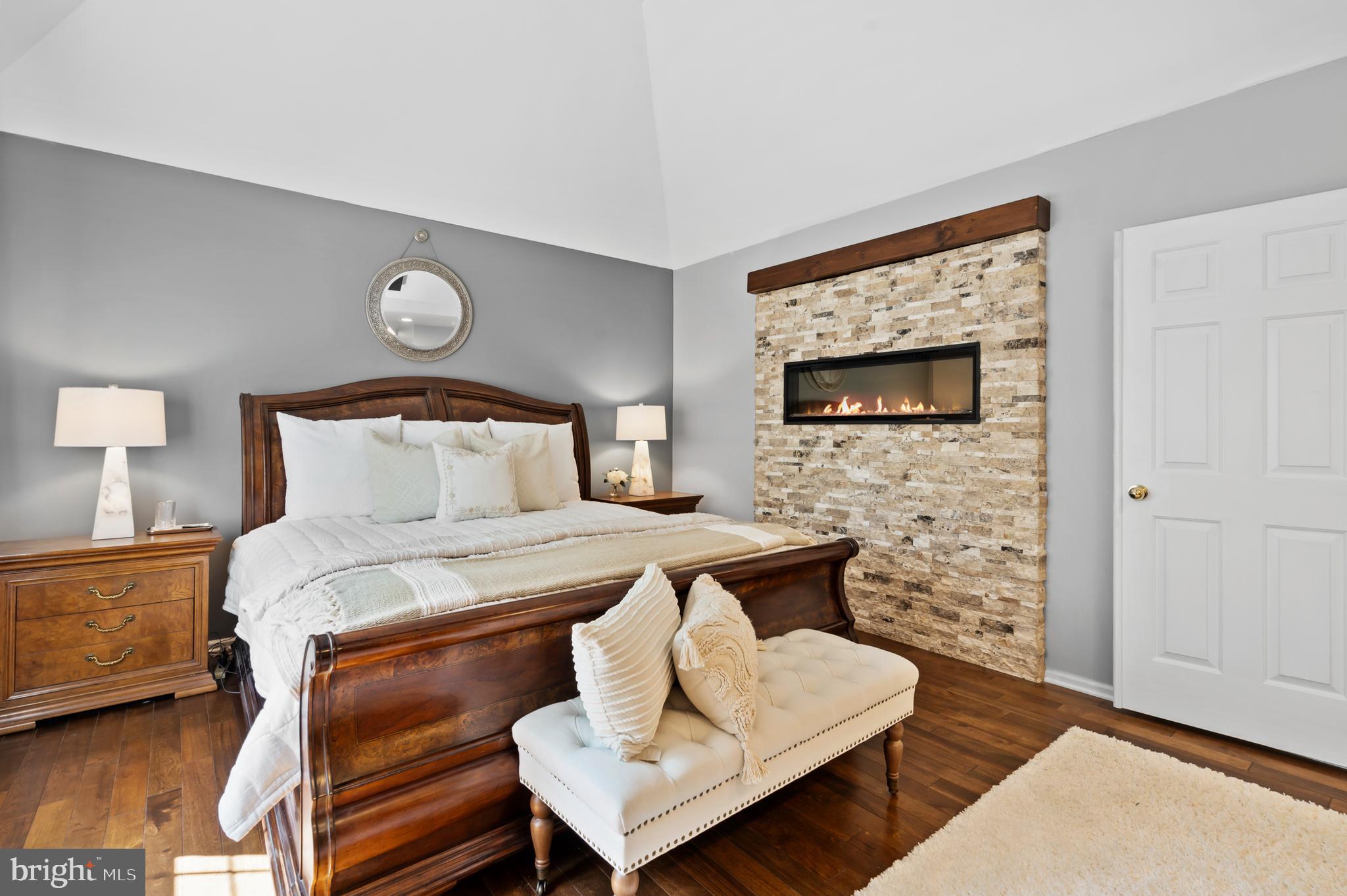 75 Bittersweet Drive Doylestown, PA 18901 - Photo 28 of 65 a bedroom with a bed and a fireplace