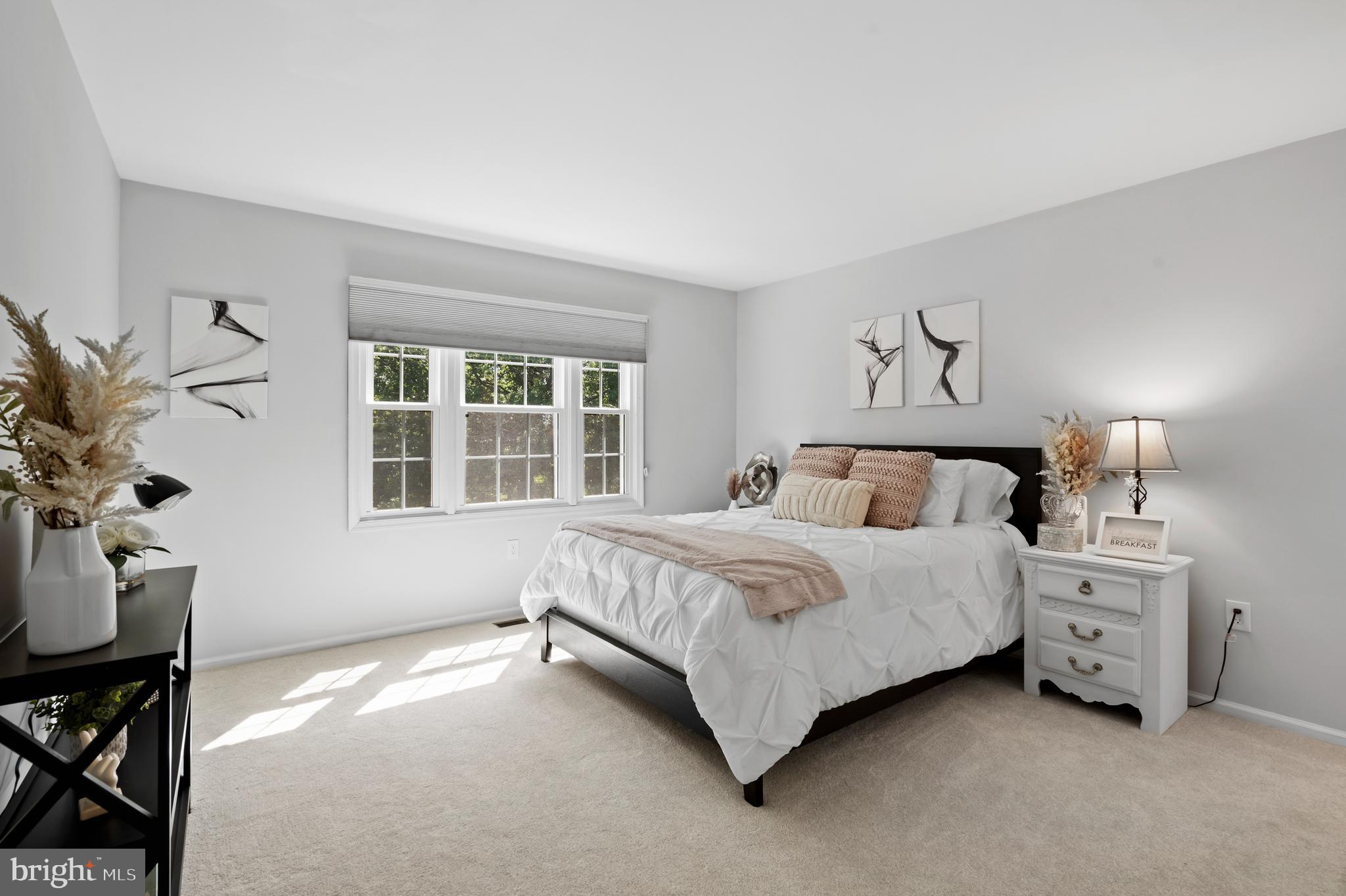 75 Bittersweet Drive Doylestown, PA 18901 - Photo 36 of 65 a spacious bedroom with a bed and a window