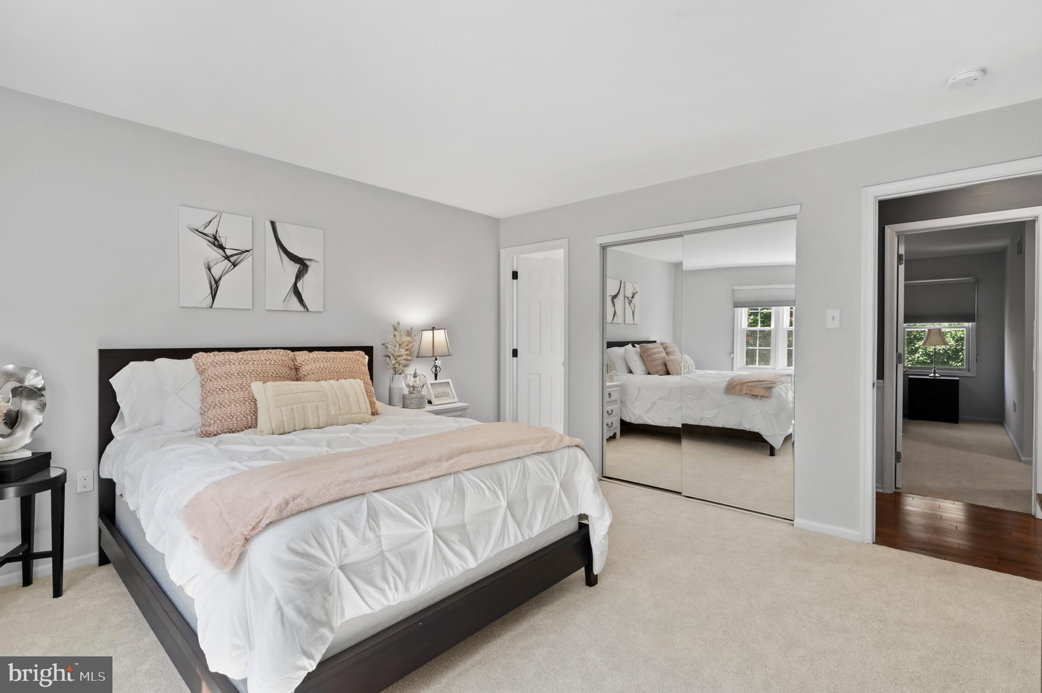 75 Bittersweet Drive Doylestown, PA 18901 - Photo 37 of 65 a bedroom with a bed couch and a mirror