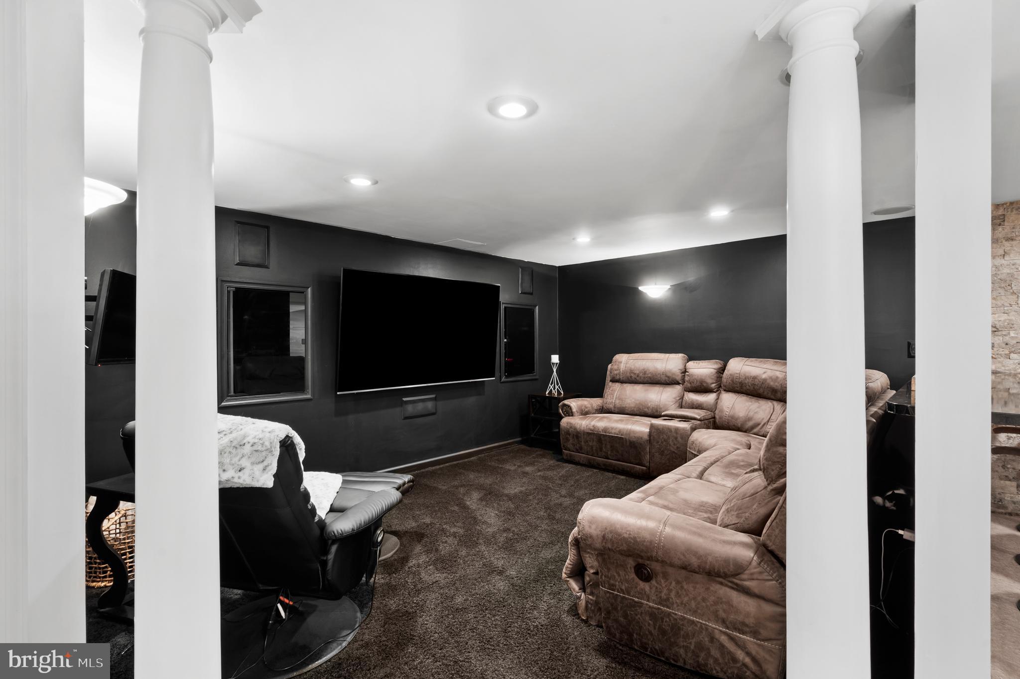 75 Bittersweet Drive Doylestown, PA 18901 - Photo 47 of 65 a living room with furniture and a flat screen tv
