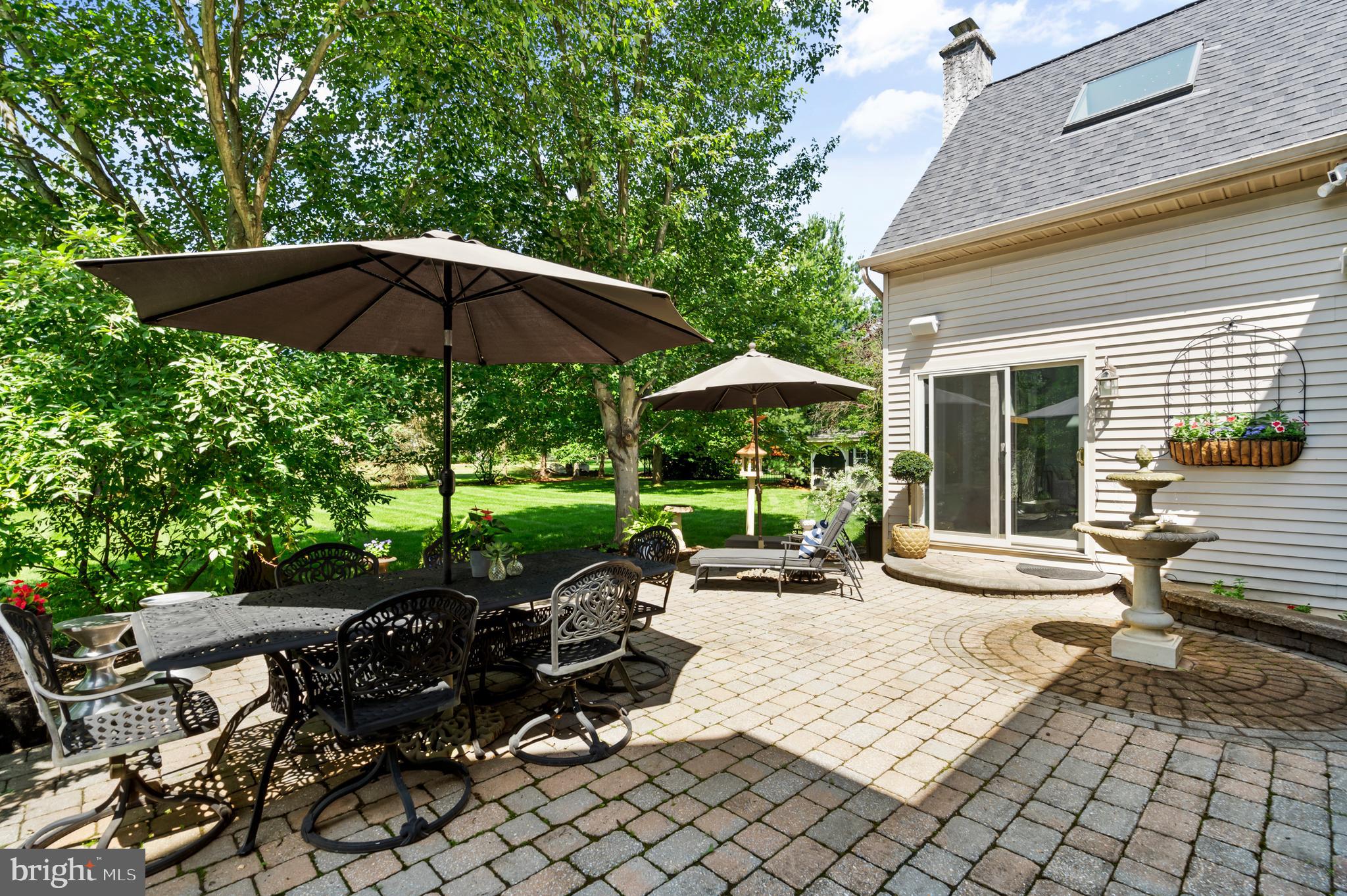75 Bittersweet Drive Doylestown, PA 18901 - Photo 54 of 65 a view of a patio with table and chairs under an umbrella