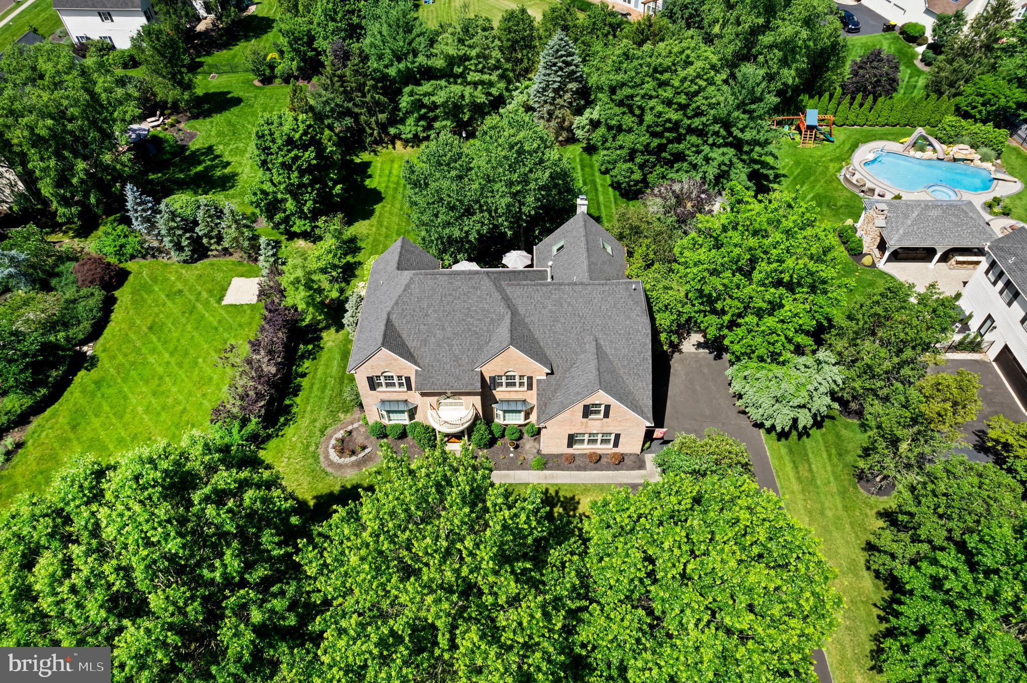 75 Bittersweet Drive Doylestown, PA 18901 - Photo 60 of 65 an aerial view of a house with table and chairs and a yard