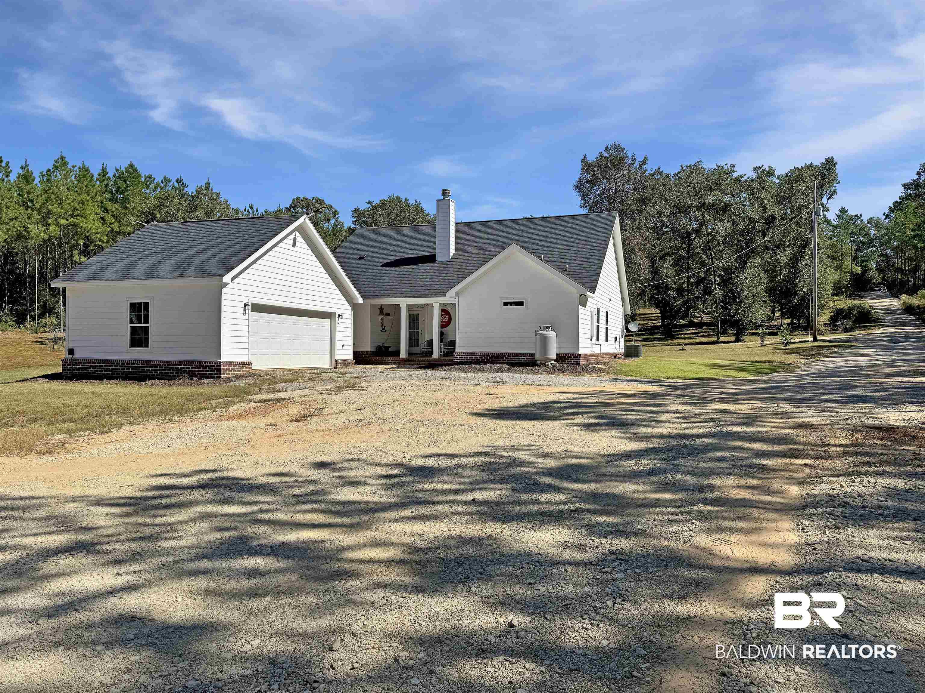 30687 Brady Road Robertsdale, AL 36567 - Photo 40 of 53 South West corner of the driveway showing the garage, back porch and driveway.