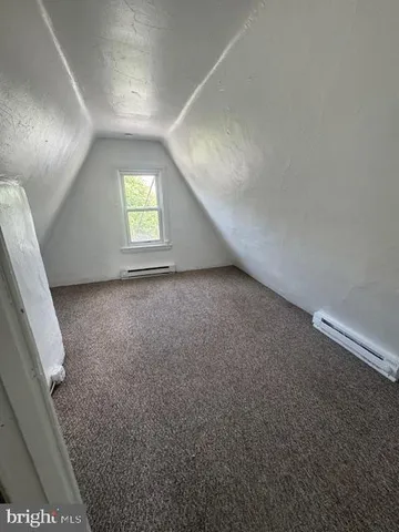 en empty room with windows and stairs