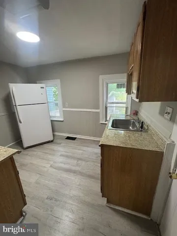 a kitchen with a stove and a refrigerator