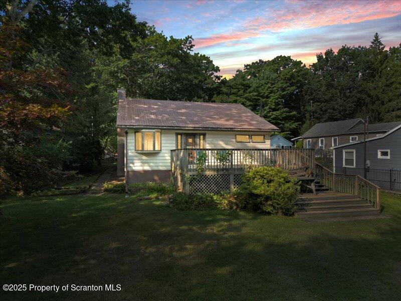 a view of house with garden