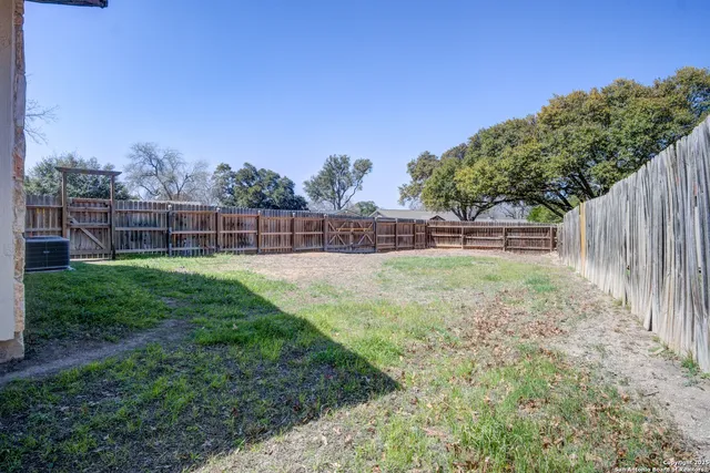 a view of outdoor space with deck and yard