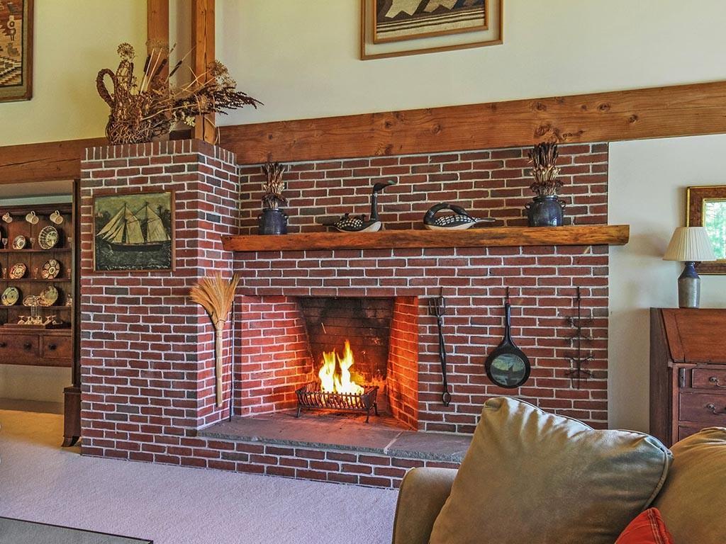 383 Harrington Road Pemaquid, ME 04558 - Photo 11 of 35 Roaring fire in the great room.