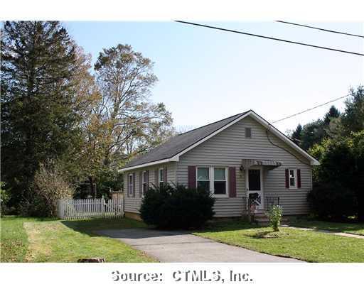 12 Stanton Road Clinton, CT 06413 - Photo 1 of 1 a front view of a house with a garden