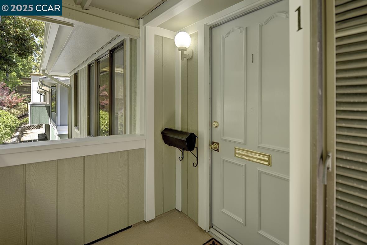 1333 Singingwood Court, Unit 1 Walnut Creek, CA 94595 - Photo 4 of 34 a bathroom with a shower and a mirror
