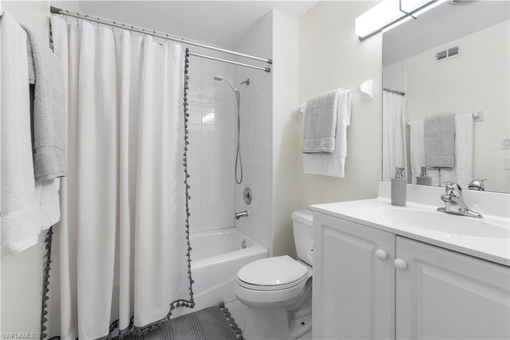 290 4th Street South, Unit 202 Naples, FL 34102 - Photo 14 of 21 a bathroom with a sink toilet and shower