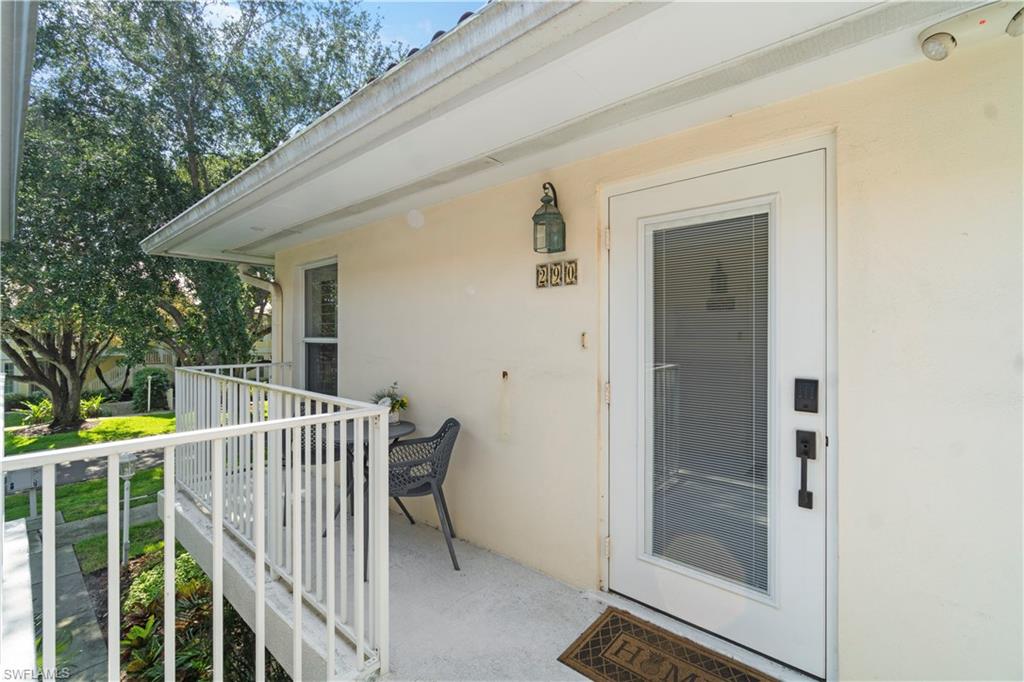 290 4th Street South, Unit 202 Naples, FL 34102 - Photo 15 of 21 a view of deck and backyard