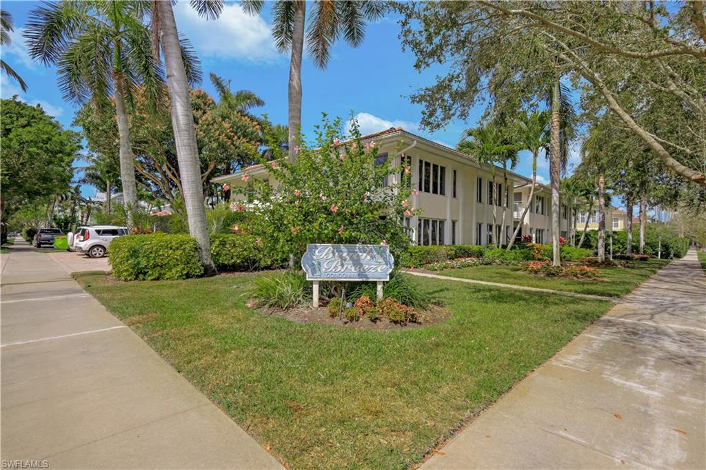 290 4th Street South, Unit 202 Naples, FL 34102 - Photo 2 of 21 a house view with a garden space